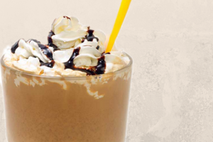 Chocolate Shake with whipped cream and straw