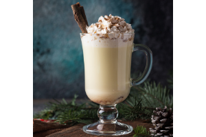 healthy holiday nog shake with pine cones and spruce tree trimmings