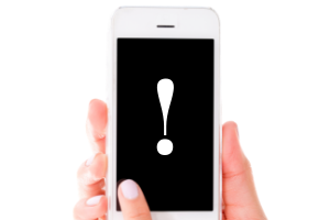 Smartphone with black screen held by female hands and white exclamation point on the screen