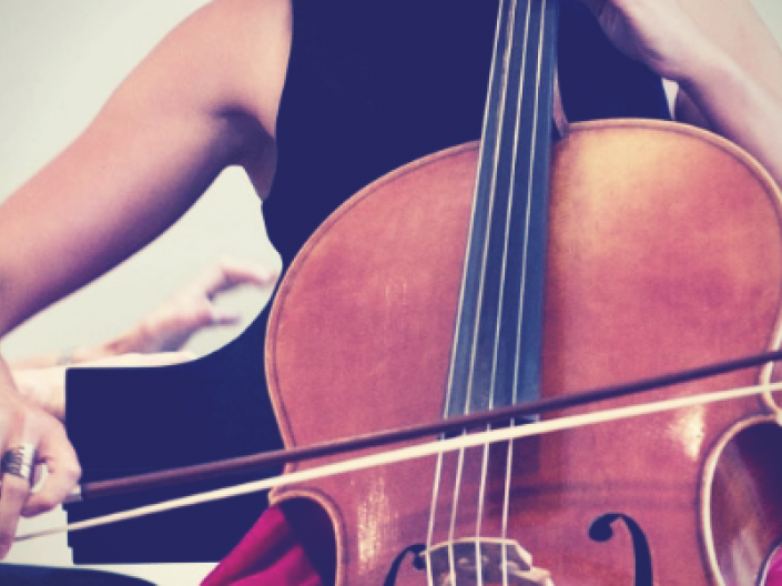 close up of woman playing cello