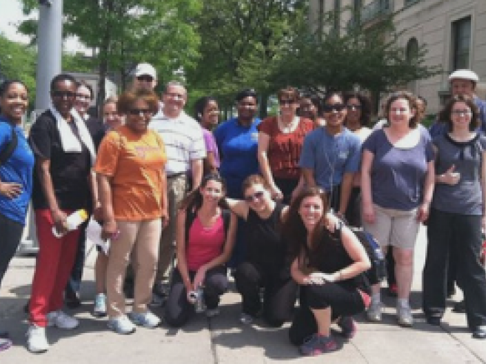 Group of people posing for camera outside