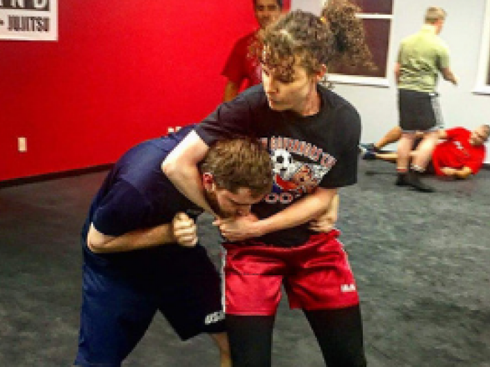 Woman holding man in a headlock