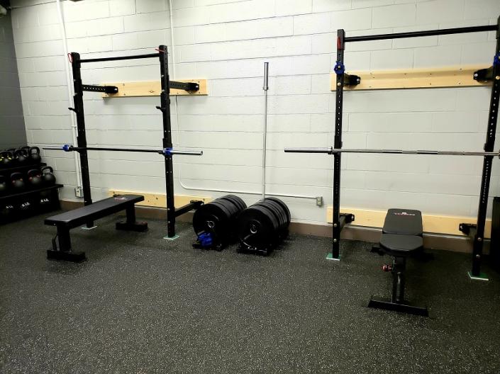 Two exercise barbell racks