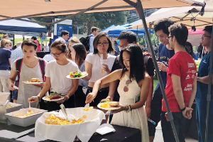 students getting food at a cookout