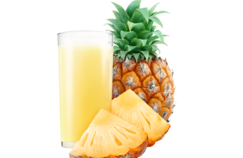 Pineapple drink with pineapple beside it