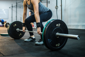 Woman starting a barbell deadlift