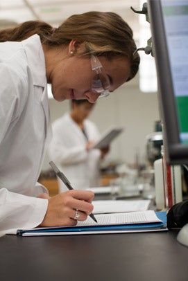 Woman in lab wearing goggles Case Western Reserve University Online Master's Degrees and Certificates in Engineering