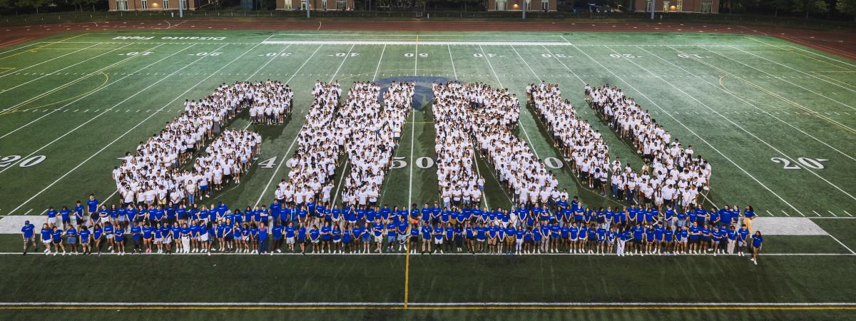 Students spell out CWRU on DiSanto Field as part of CWRU's Tradition event