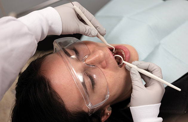 photo of a person getting a dental checkup