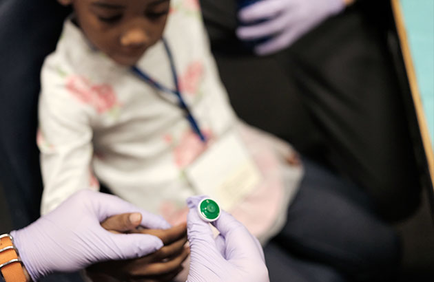 photo of a child getting a blood test
