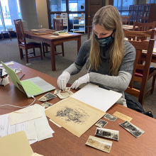 Kellyn Toombs sorting through archival materials at the Cummings Center