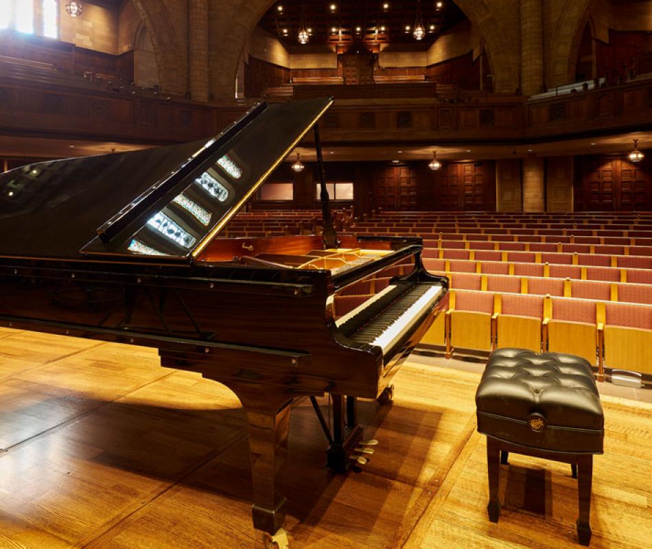 grand piano and bench onstage at the Maltz Performing Arts Center