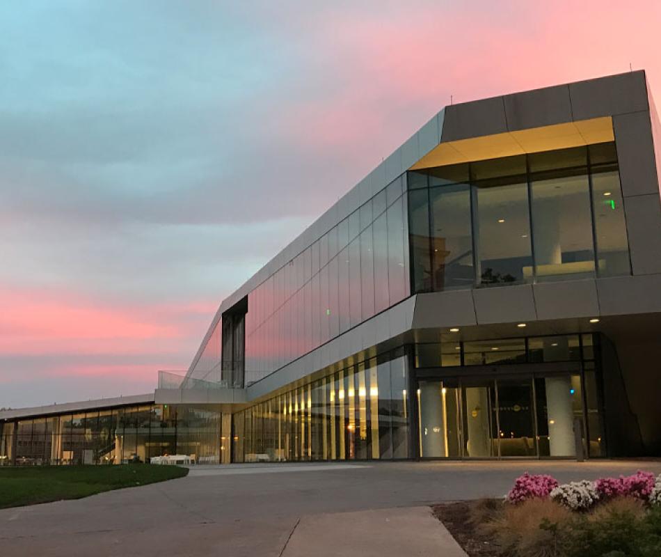 Twilight view of the exterior of Tinkham Veale University Center