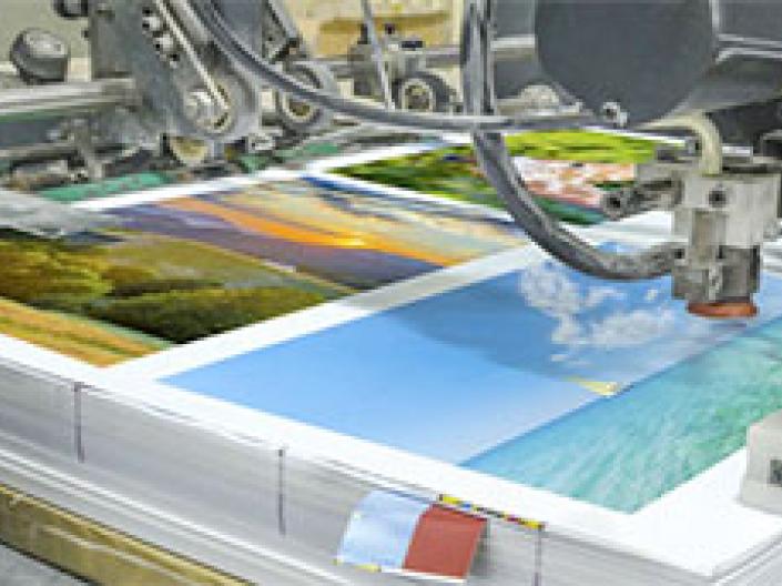 Printing machine printing landscape photos