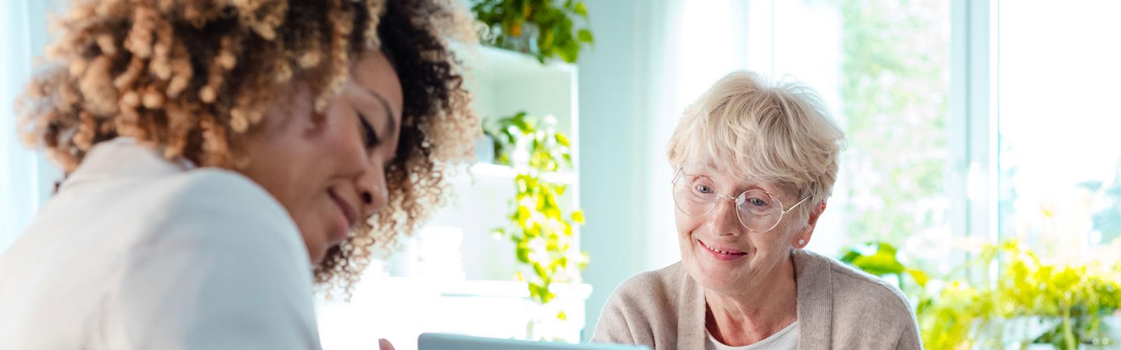 A nutritionist working with a senior on her diet
