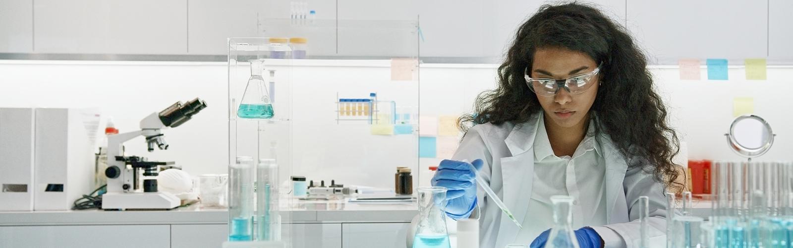 Female scientist working on laboratory glassware
