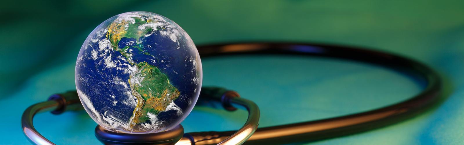 A small world sitting on top of a stethoscope 