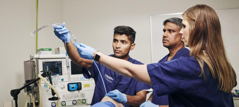 Anesthesiology students working in a lab 