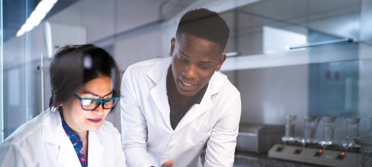 Two students talking in a lab