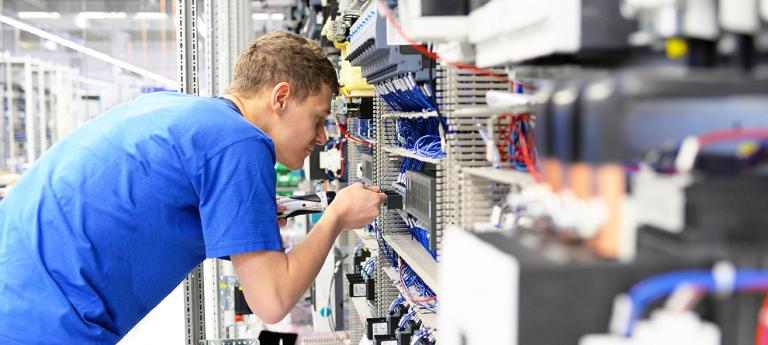 Electrical Engineering student working in a data center