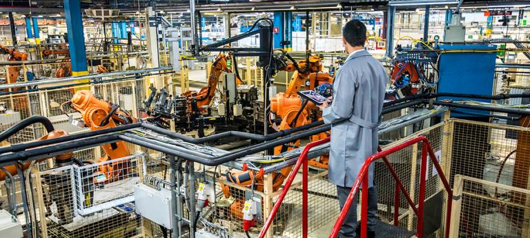 Mechanical Engineering student on the floor of a factory