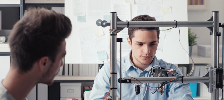 Two mechanical engineering students working on a project