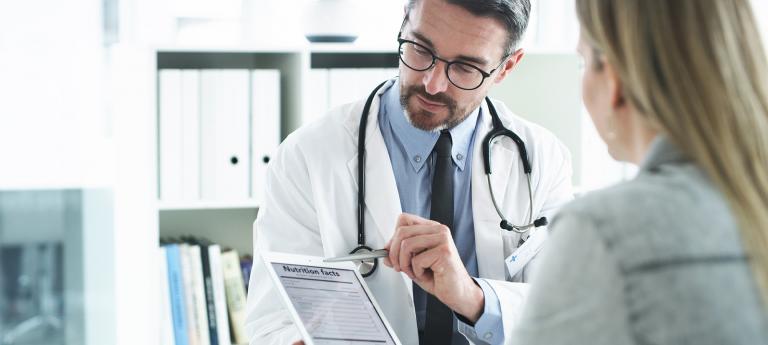 Nutritionist going over a food label with a patient