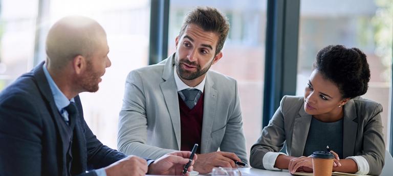 FT MBA Students talking at a table