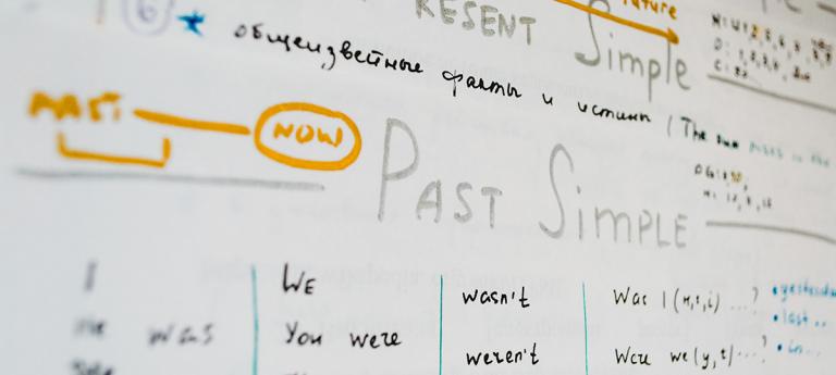 A white board with past simple tenses explained