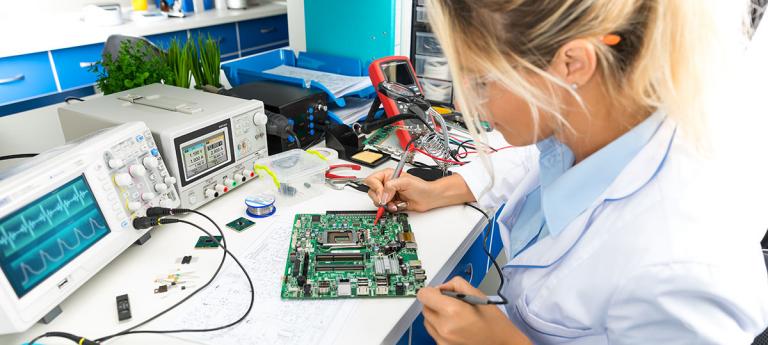 A student working on a circuit board