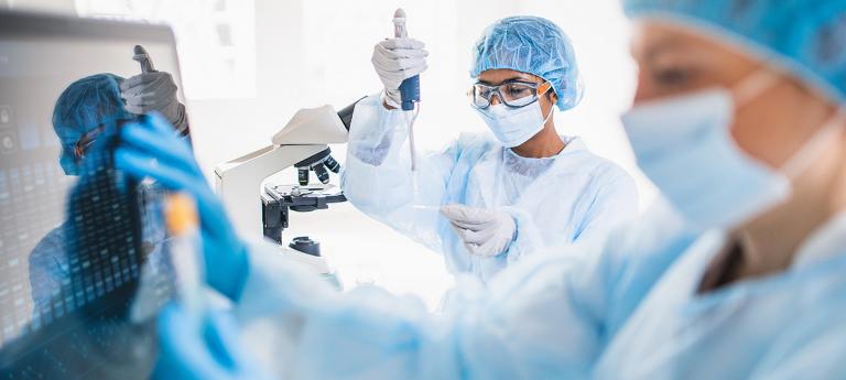 People working in a lab analyzing samples