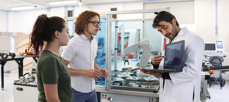 Students working in a lab together