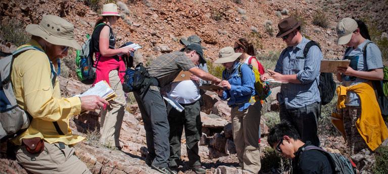 A group of Case Western Reserve University students and faculty on a geology site