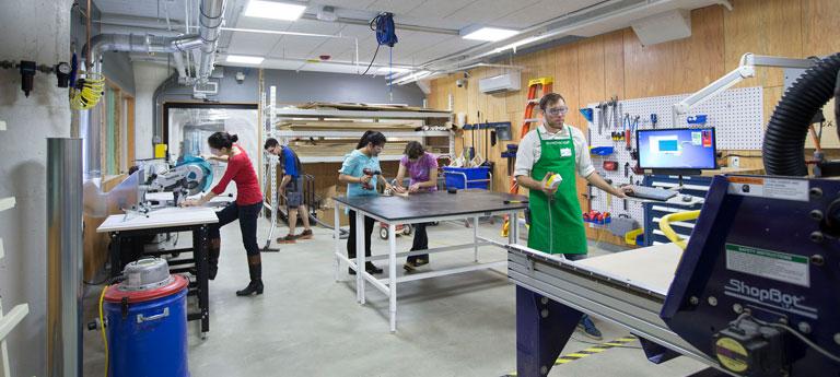 Case Western Reserve University students work in Sears think[box] machinery area