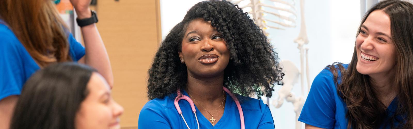 Several MN students laughing