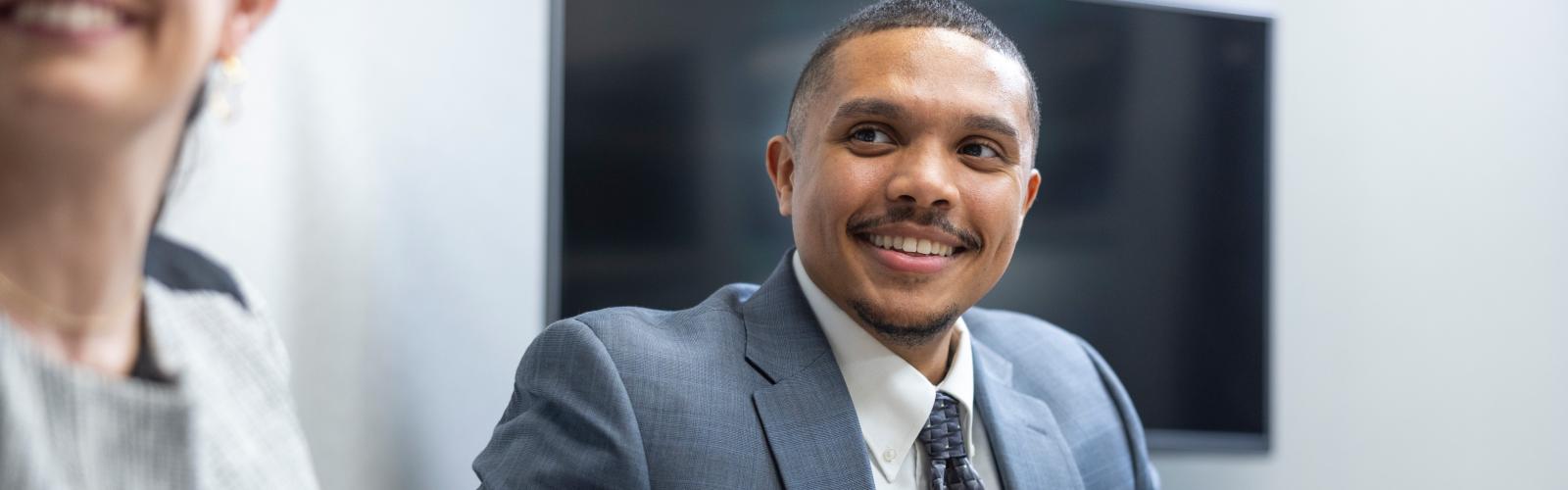 A law student smiling