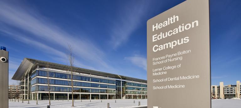 Wide shot of the Health Education Campus with large sign in view