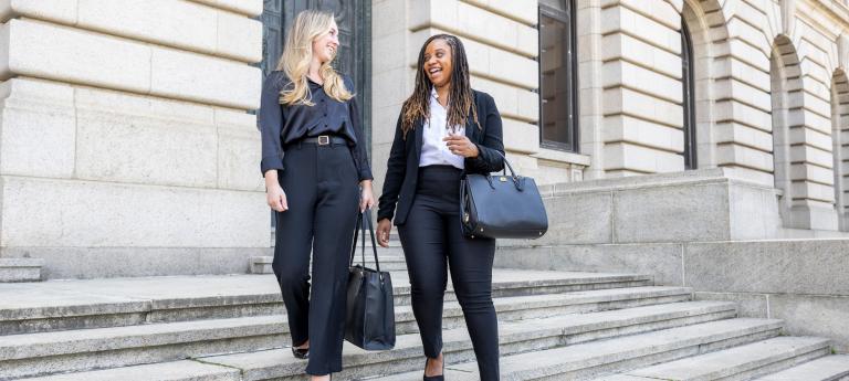 Two law students walking outside a courthouse
