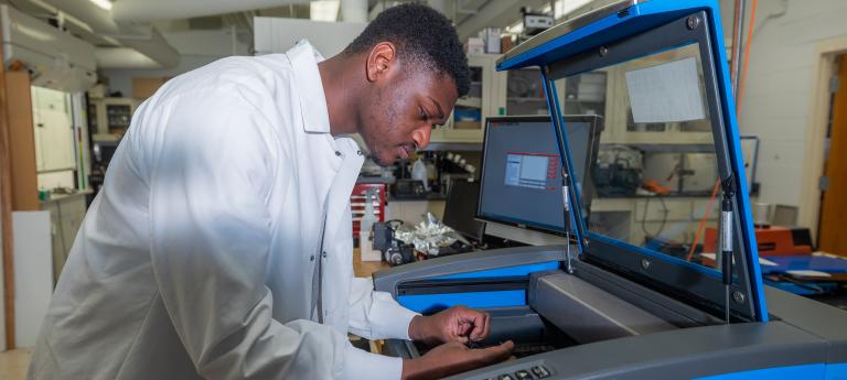 Mechanical engineering student in a lab