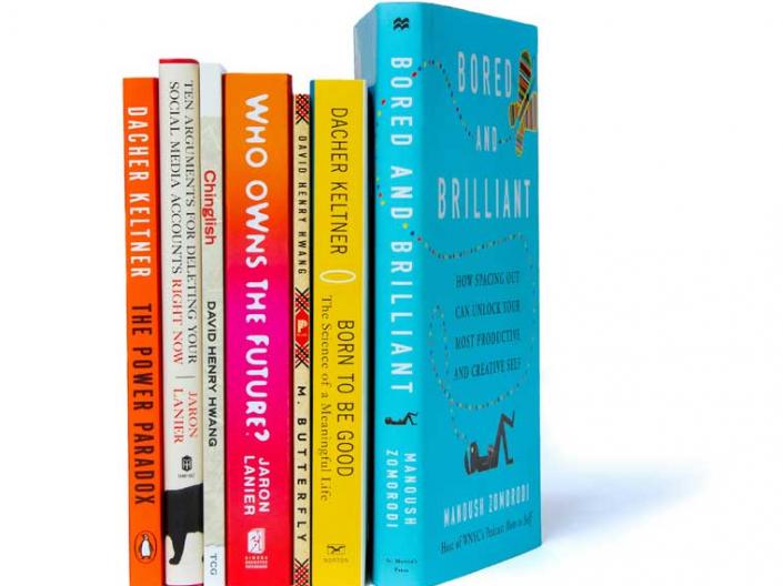 Stack of books by various authors, including those in the Think Forum series.