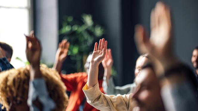A group of hands raised