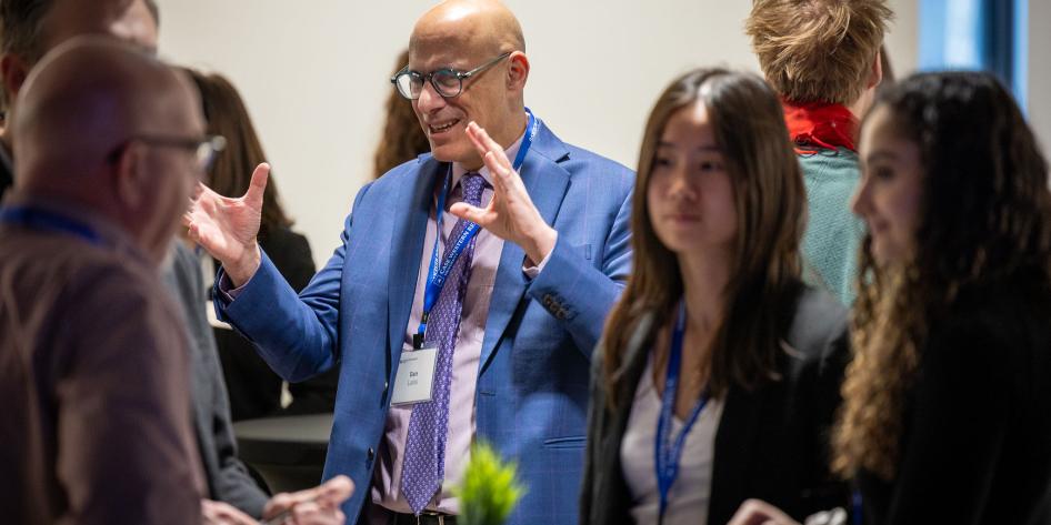 Prof. Dan Lacks speaking to a group of people