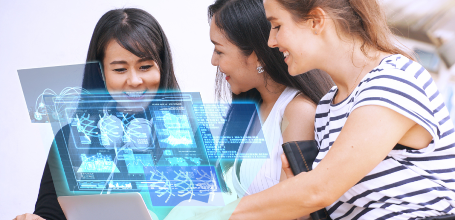 A group of women looking at a projected image of a computer screen.