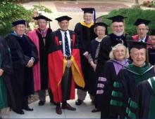 A group of emeriti standing together smiling.