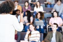An instructor in front of a class of students.