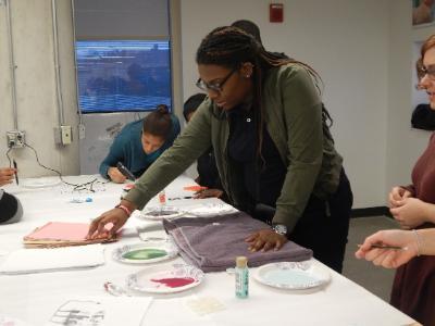A female Cleveland high school student participating in an art class