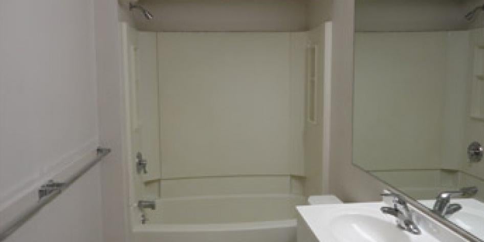 White bathroom with shower and bath