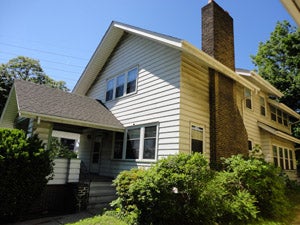 White home with brick chimney in University Circle, Cleveland Ohio