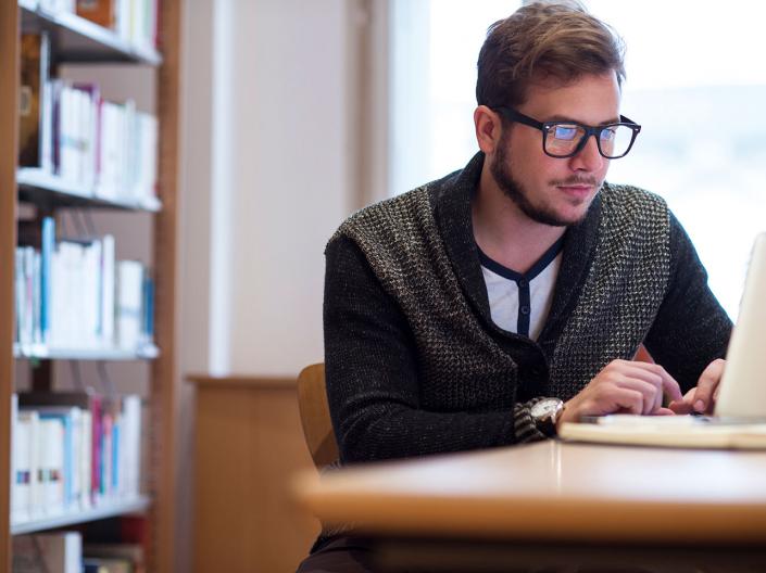 A Case Western Reserve University student using a computer