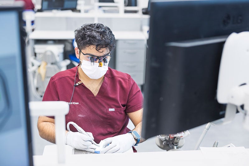 Researcher looking at computer